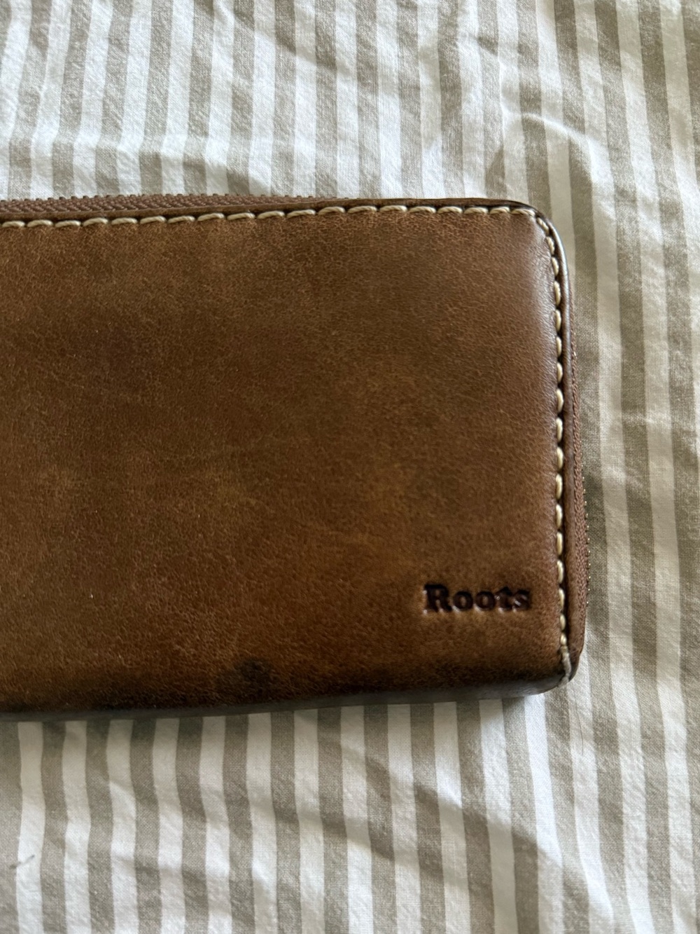 ROOTS | leather zip around clutch tribe wallet